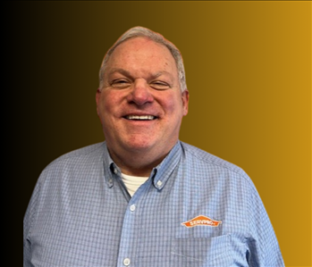 Man standing in front of orange background