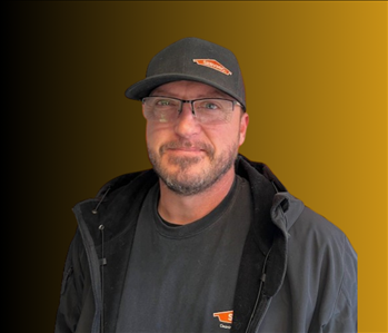 Man standing in front of orange background